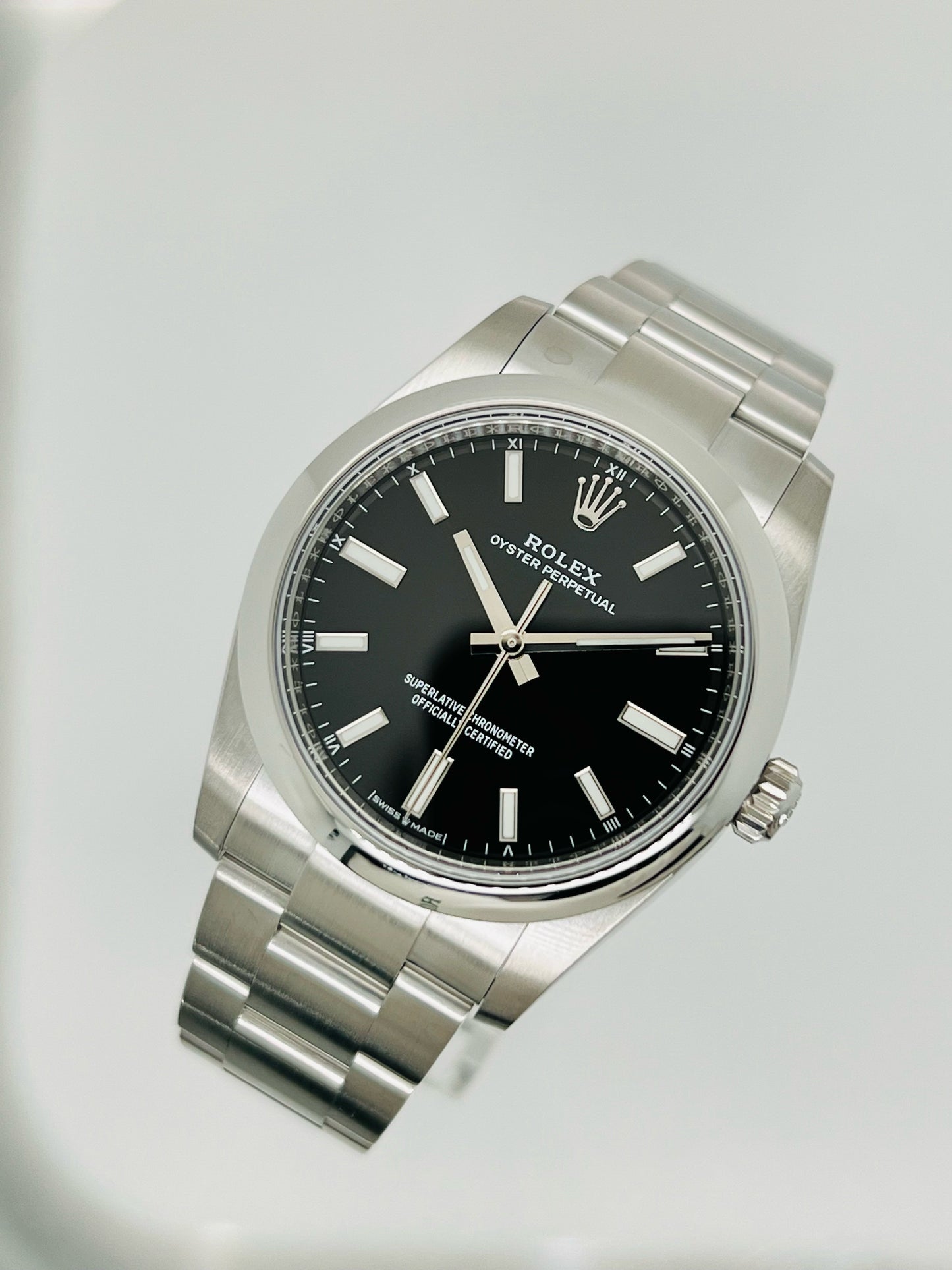 Rolex Oyster Perpetual 34mm stainless steel black index dial and smooth bezel model# 124200