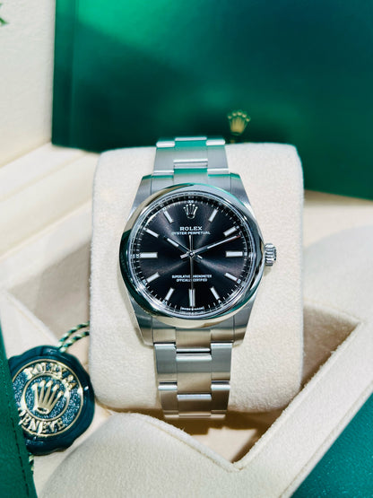 Rolex Oyster Perpetual 34mm stainless steel black index dial and smooth bezel model# 124200