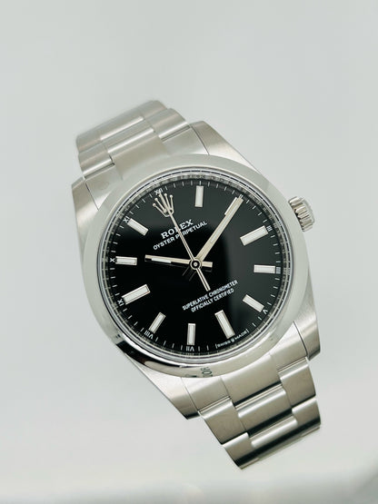 Rolex Oyster Perpetual 34mm stainless steel black index dial and smooth bezel model# 124200