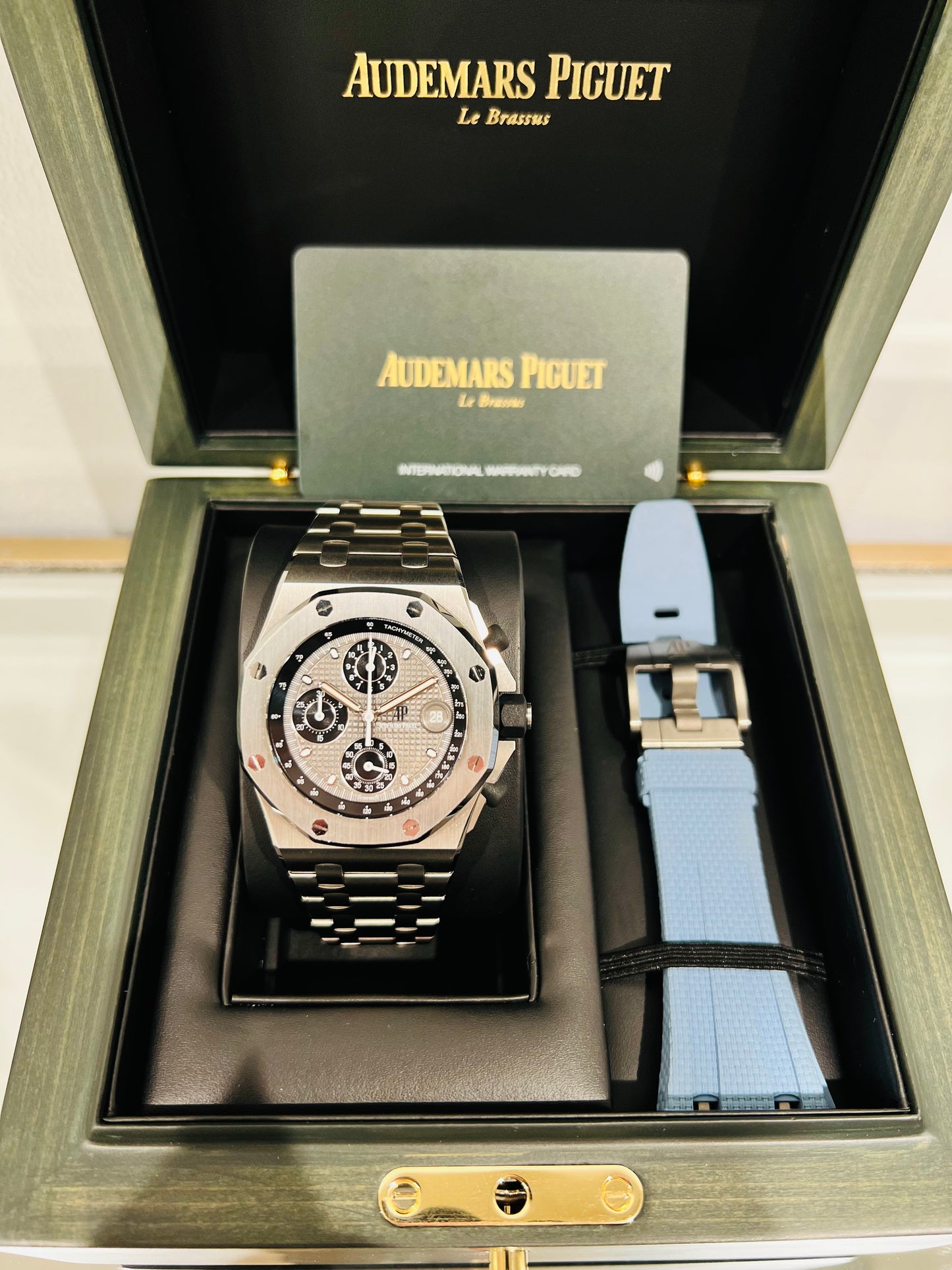 Audemars Piquet Royal Oak Offshore Titanium Men’s Watch. Titanium octagonal case 42mm. Blue rubber pusher and crown Model #26238TI.OO.2000TI.01