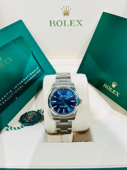 Rolex Oyster Perpetual Blue Dial 34mm Stainless Steel Smooth Bezel Model # 124200