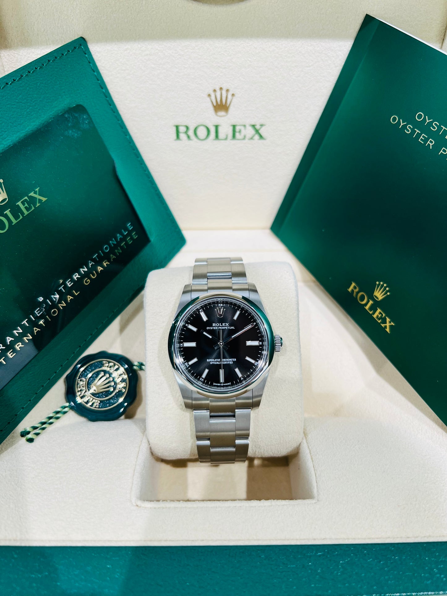 Rolex Oyster Perpetual 34mm stainless steel black index dial and smooth bezel model# 124200