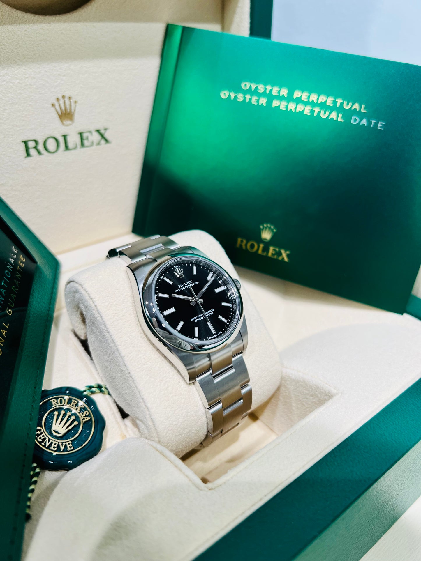 Rolex Oyster Perpetual 34mm stainless steel black index dial and smooth bezel model# 124200