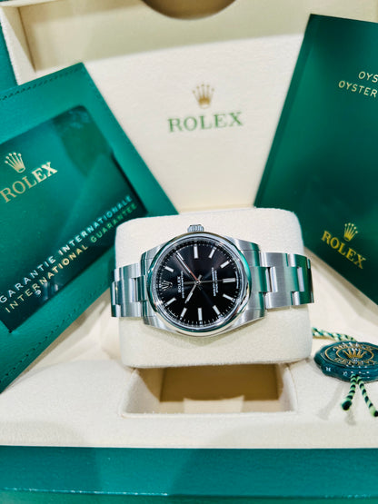 Rolex Oyster Perpetual 34mm stainless steel black index dial and smooth bezel model# 124200