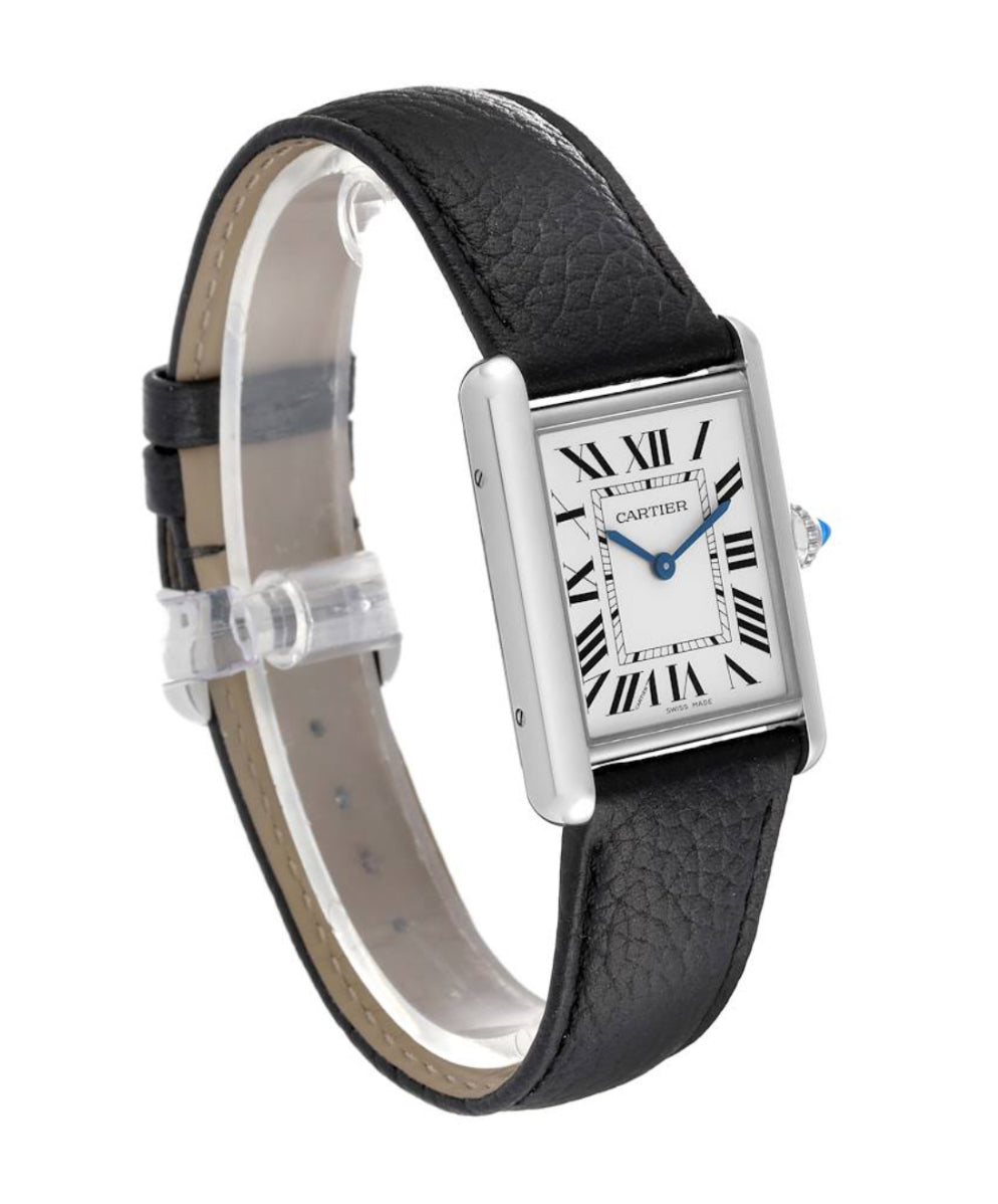 Cartier Tank Must Watch, High Autonomy Quartz Movement, Steel Case, Beaded Crown Set with a Synthetic Cabochon-Shaped Spinel, SilveredDial, Blued-Steel Sword-shaped Hands, Steel Ardillon Buckle, 33.7mm x 25.5mm.  Model # WSTA0041
