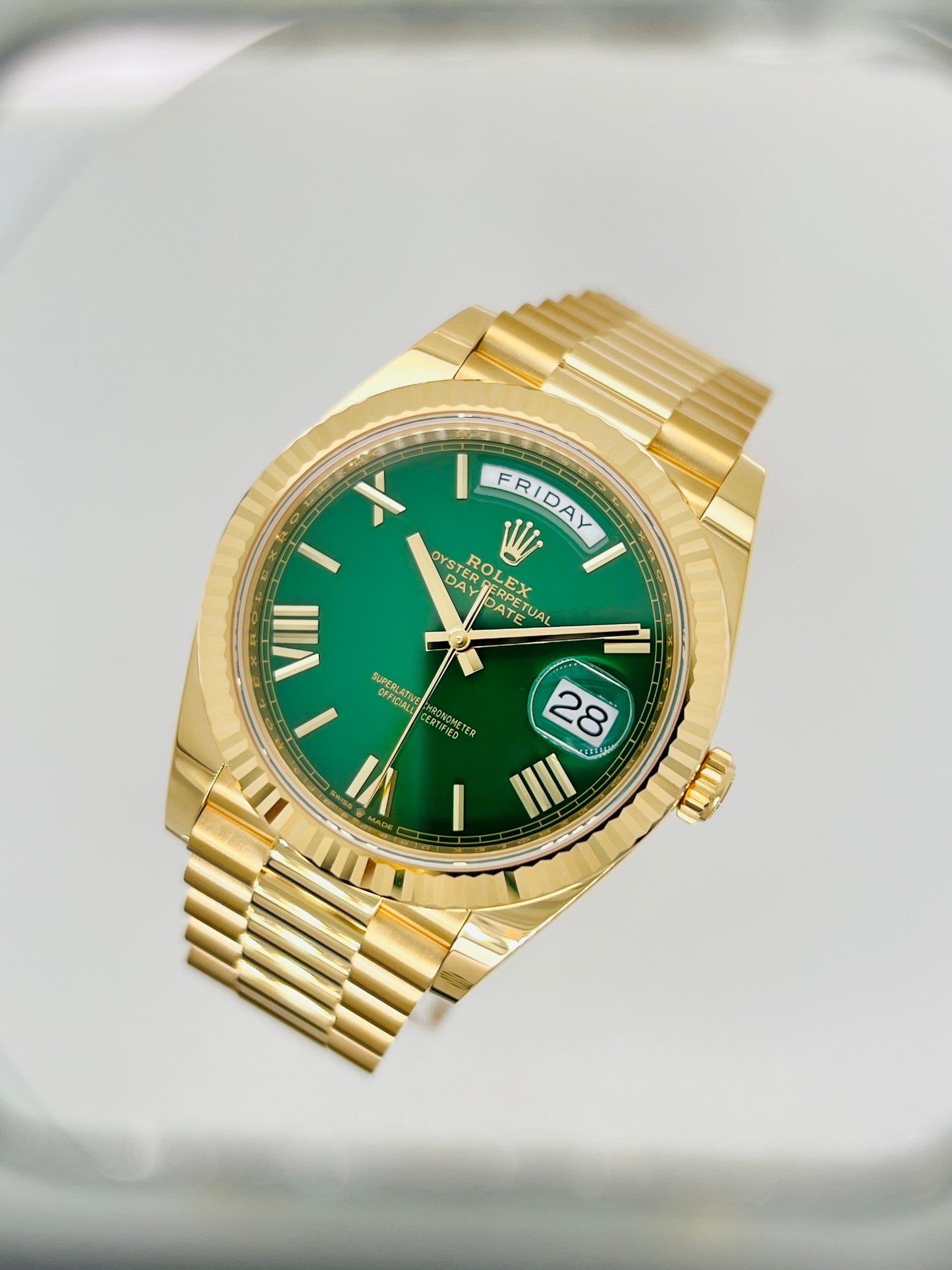 Rolex Day-Date, Green Roman Dial, Fluted Bezel, 18K Gold Presidential Bracelet.  Model # 228238