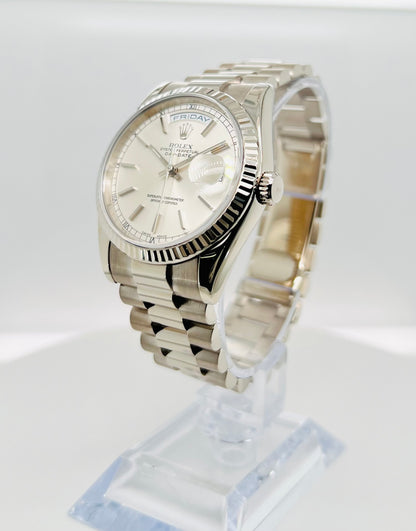 Rolex Day-Date 36mm, White Gold Silver Index Dial with Roman Indices, 18k White Gold Fluted Bezel, White Gold Case, 18k White Gold Presidential Bracelet. Model# 18239