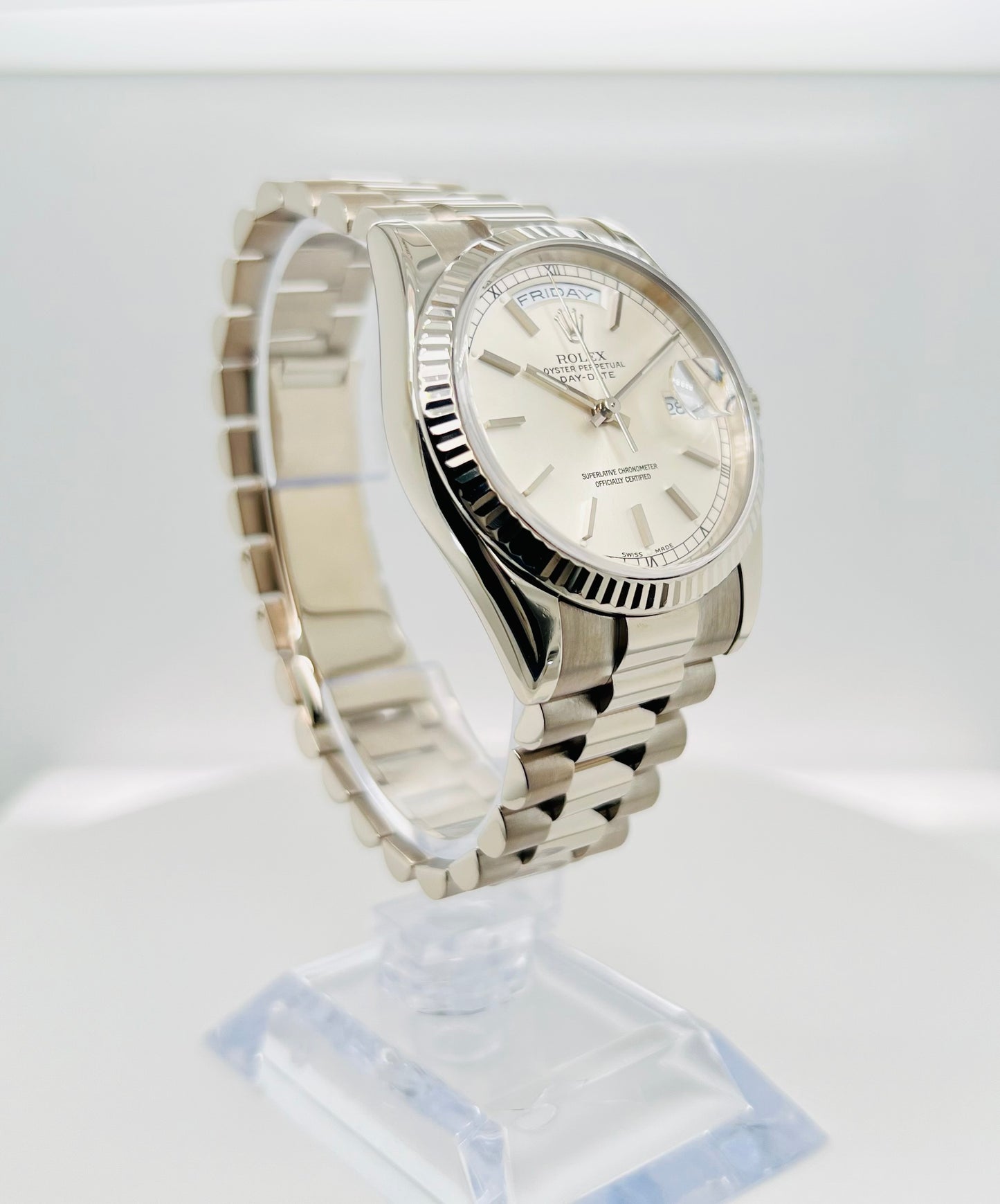 Rolex Day-Date 36mm, White Gold Silver Index Dial with Roman Indices, 18k White Gold Fluted Bezel, White Gold Case, 18k White Gold Presidential Bracelet. Model# 18239