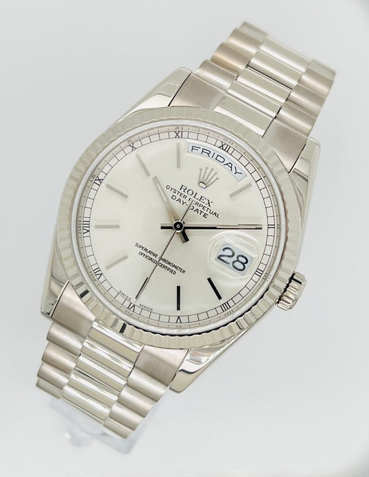 Rolex Day-Date 36mm, White Gold Silver Index Dial with Roman Indices, 18k White Gold Fluted Bezel, White Gold Case, 18k White Gold Presidential Bracelet. Model# 18239