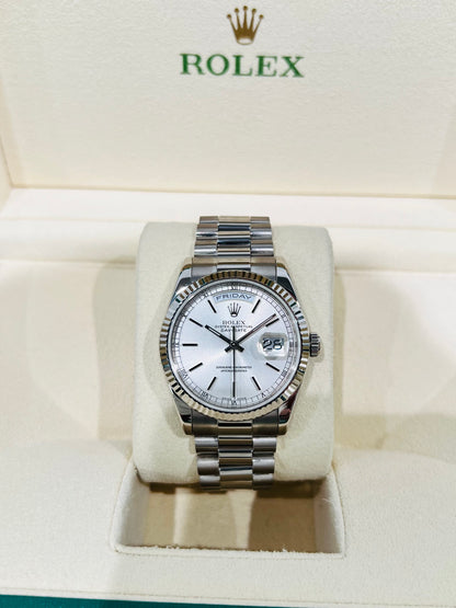 Rolex Day-Date 36mm, White Gold Silver Index Dial with Roman Indices, 18k White Gold Fluted Bezel, White Gold Case, 18k White Gold Presidential Bracelet. Model# 18239