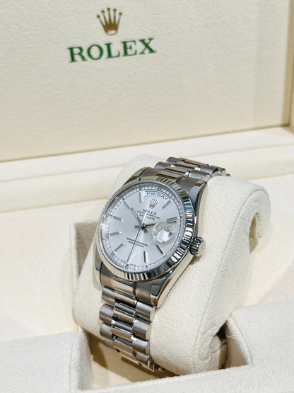 Rolex Day-Date 36mm, White Gold Silver Index Dial with Roman Indices, 18k White Gold Fluted Bezel, White Gold Case, 18k White Gold Presidential Bracelet. Model# 18239